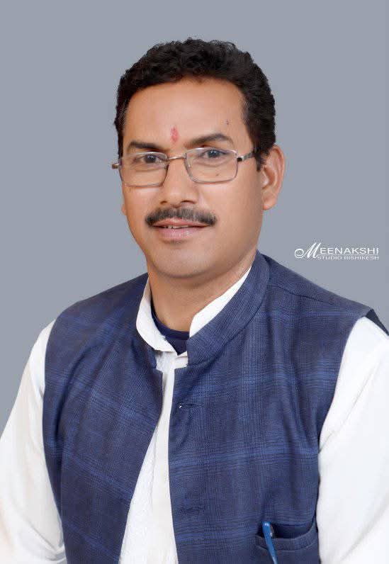 Bachan Bisht with villagers